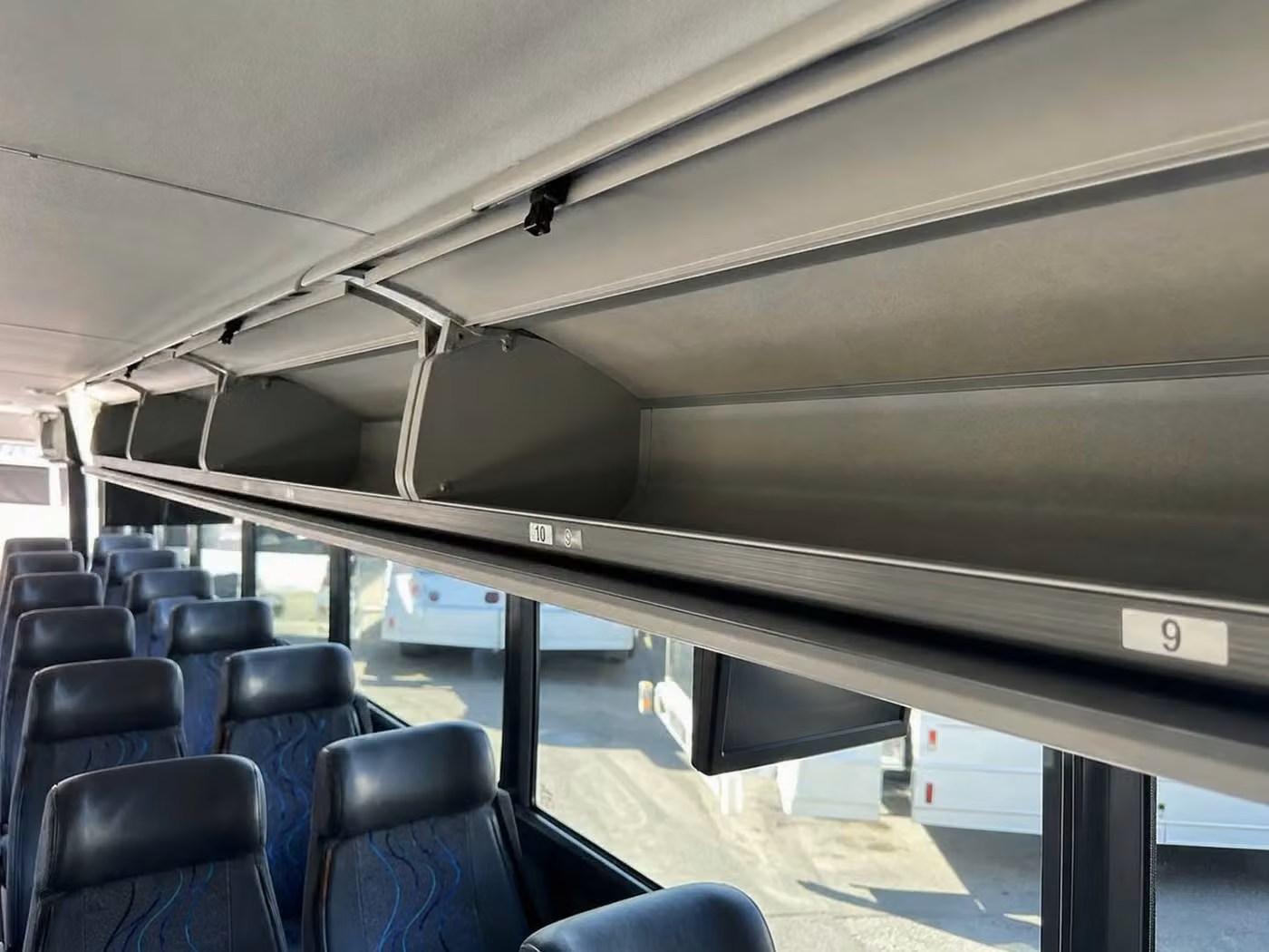 hollister 25 passenger minibus overhead storage
