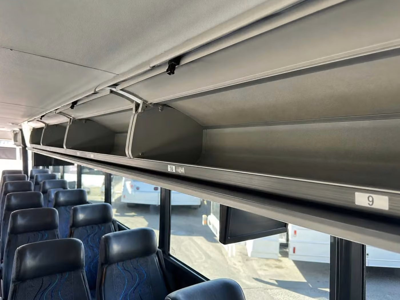 hollister 56 passenger charter bus overhead storage